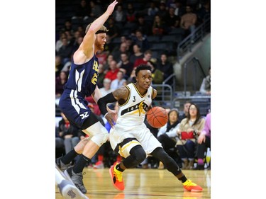 Alex Johnson of the London Lightning runs past Russell Byrd of the St John's Edge during their NBL game at Budweiser Gardens on Thursday, Feb. 21, 2019.  Mike Hensen/The London Free Press