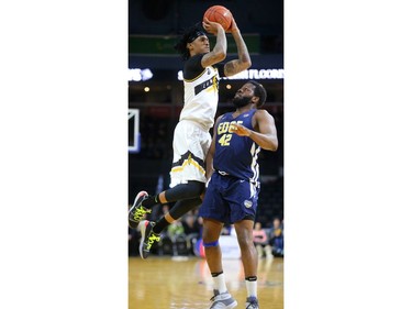 Maurice Bolden of the London Lightning pulls up for a jump shot over Olu Ashaolu of the St John's Edge during their NBL game at Budweiser Gardens on Thursday, Feb. 21, 2019.  Mike Hensen/The London Free Press