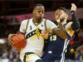 Kevin Ware Jr. of the London Lightning gets the blocking foul and the hoop after running into Diego Kapelan of the St John's Edge and then converting the three-point play during their NBL game at Budweiser Gardens on Thursday, Feb. 21, 2019.  (Mike Hensen/The London Free Press)