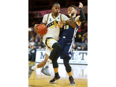 Kevin Ware Jr. of the London Lightning gets the blocking foul and the hoop after running into Diego Kapelan of the St John's Edge and then converting the three-point play during their NBL game at Budweiser Gardens on Thursday, Feb. 21, 2019.  Mike Hensen/The London Free Press