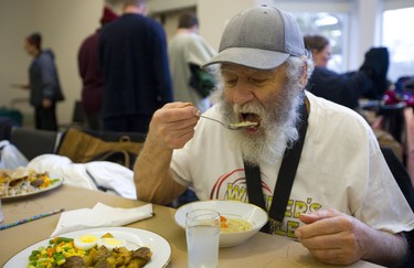 Roger Belanger digs into the chicken noodle soup Sunday at the Jewish Community Centre. For the 13th year straight the organization has been hosting a Come out of the Cold meal for anyone in London who needs a warm meal. Belanger, says he remembers from last year, how good the soup tasted, about 300 people were served in the centre, most arriving by buses organized to pick up groups in downtown and east London.  Mike Hensen/The London Free Press