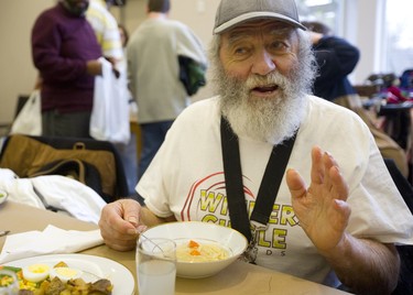 Roger Belanger enjoys the chicken noodle soup Sunday at the Jewish Community Centre. For the 13th year straight the organization has been hosting a Come out of the Cold meal for anyone in London who needs a warm meal. Belanger, says he remembers from last year, how good the soup tasted, about 300 people were served in the centre, most arriving by buses organized to pick up groups in downtown and east London.  Mike Hensen/The London Free Press