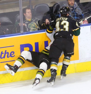 Knights Paul Cotter takes Mitchell Russell of the Battalion off his skates as he rubs him into the boards during their afternoon game Sunday February 24, 2019 at Budweiser Gardens.  The Knights finally got their offence running with 8 goals so far in the game. Mike Hensen/The London Free Press/Postmedia Network