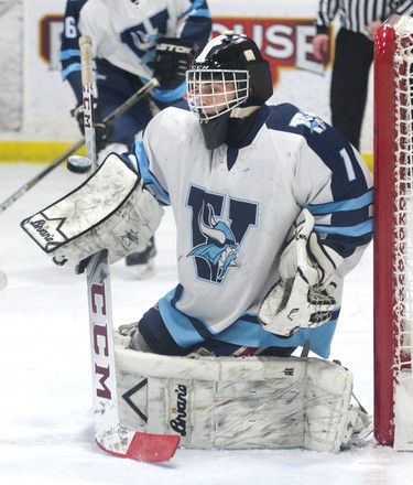 Lucas Vikings goalie Jared Burbine makes a blocker save during their game against the Medway Cowboys at Nichols Arena in London, Ont. on Tuesday. The Cowboys won the game 6-1 to take the championship series two games to none. Derek Ruttan/The London Free Press/Postmedia Network