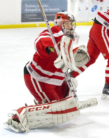 Medway Cowboys goalie Quinton Duncan makes a blocker save during their game against the Lucas Vikings at Nichols Arena in London, Ont. on Tuesday. The Cowboys won the game 6-1 to take the championship series two games to none. Derek Ruttan/The London Free Press/Postmedia Network