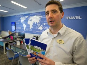Mark Johnston, the store manager for CAA on Wonderland Road and Beaverbrook says that their famous TripTiks are still in demand for travellers, often as backup or complement to GPS for their trips.  (Mike Hensen/The London Free Press)