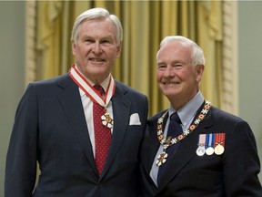 Governor General David Johnston stands with Michael Wilson after investing him as a Companion of the Order of Canada during a ceremony at Rideau Hall in Ottawa on November 17, 2010. Wilson, a former cabinet minister, diplomat and longtime mental health advocate, has died at 81.