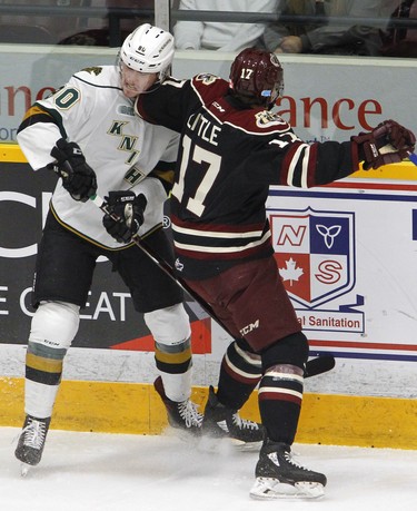Peterborough Petes' Michael Little elbows London Knights' Alex Formenton during first period OHL action on Thursday, Feb. 21, 2019 at the Memorial Centre in Peterborough. (Clifford Skarstedt, Peterborough Examiner)