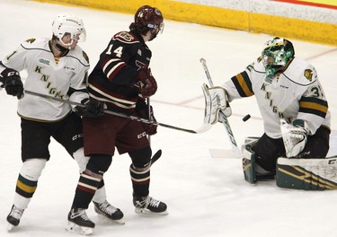 Peterborough Petes' Liam Kirk (14) deflects the puck at London Knights' goalie Joseph Raaymakers during first period OHL action on Thursday, Feb. 21, 2019 at the Memorial Centre in Peterborough. (Clifford Skarstedt, Peterborough Examiner)