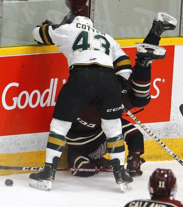 Peterborough Petes' Declan Chisholm is upended by London Knights' Paul Cotter during first period OHL action on Thursday, Feb. 21, 2019 at the Memorial Centre in Peterborough. (Clifford Skarstedt, Peterborough Examiner)