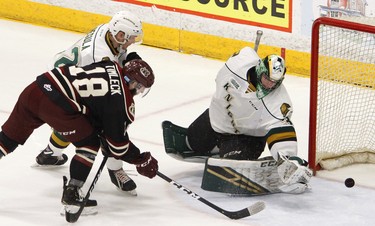 Peterborough Petes' Adam Timleck fires the puck past London Knights' goalie Joseph Raaymakers as Alec Regula moves in during first period OHL action on Thursday, Feb. 21, 2019 at the Memorial Centre in Peterborough. (Clifford Skarstedt, Peterborough Examiner)