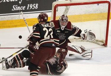 Peterborough Petes' Shawn Spearing blocks a shot between teammates Chad Denault and goalie Tye Austin during first period OHL action between the Petes and London Knights on Thursday, Feb. 21, 2019 at the Memorial Centre in Peterborough. (Clifford Skarstedt, Peterborough Examiner)