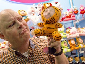 London Free Press reporter Dan Brown shows off his Me Doll, a stuffed miniature sporting a 3D model of his own face in London, Ontario on Tuesday September 9, 2014. (Free Press file photo)