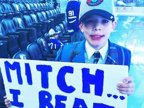 Brock Chessell, 12, holds up a sign directed at Mitch Marner prior to the Toronto Maple Leafs game against Anaheim Monday night. Marner gave him an autographed stick during warmups. Handout/Stratford Beacon Herald/Postmedia Network