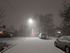 A snowy streetscape in Windsor Sunday night, typical of much of Southwestern Ontario. (Taylor Campbell/The Windsor Star)