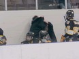 A submitted photo shows a Waterloo Wolves coach locked in a fight with another man. Waterloo police confirm they are investigating an assault on the team's coaching staff by a parent.