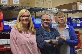 Regional HIV/AIDS Connection staff Sonja Burke, left, Blair Harvey and Karen Burton with harm reduction supplies in the needle exchange room at 186 King Street, the temporary overdose prevention site from the city. (Jennifer Bieman/The London Free Press)