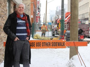 Jonathon Bancroft-Snell, owner of Jonathon's Gallery, stands next to an area on Dundas Street that was closed Tuesday as crews complete some preliminary work ahead of the construction of Phase 2 of the Dundas Place project. Bancroft-Snell wants unimpeded access to businesses during Juno week, which he sees as an opportunity to make up for lost revenue once construction begins March 18. (JONATHAN JUHA, The London Free Press)