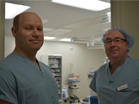 Advanced Medical Group medical director Brian Rotenberg, left, and Edward McGowan, registered nurse and surgical centre manager, stand outside the general surgery operating suite at the Victoria Street clinic before the first procedure of the day Tuesday Feb. 11, 2019. (Jennifer Bieman/The London Free Press)
