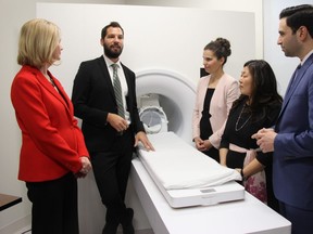 Western University professor and researcher Ryan Stevenson, left, shows an MRI scanner purchased through federal funds to Kate Young, Liberal MP for London West, left, fellow MPs Kirsty Duncan and Mary Ng, and Peter Fragiskatos, Liberal MP for London North Centre. The federal politicians were at the school Wednesday morning for a funding announcement to support research across Canada. JONATHAN JUHA/THE LONDON FREE PRESS
