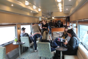Passengers relax and socialize aboard a musician-packed train dubbed the Juno Express, which rolled into London Friday afternoon for this weekend's awards bash. (Megan Stacey/The London Free Press)