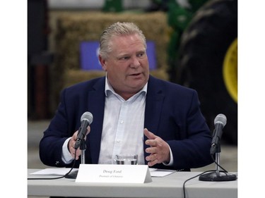 Ontario Premier Doug Ford talks before a roundtable with local farmers at Veldale Farms Ltd. south of Woodstock on Thursday. (Greg Colgan/Postmedia Network)
