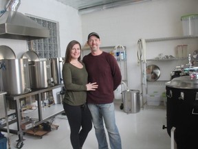 Fran and Rick Dunseith stand in their new brewery called Caps Off Brewing Company on Curtis Street in St. Thomas. The couple is in the process of getting the liquor license and hopes to open the brewery in March. (LAURA BROADLEY, Times-Journal)