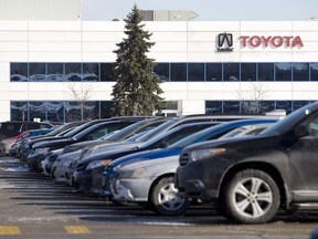 Parked cars line the parking lot at the Toyota plant in Cambridge, Ontario. (File photo)
