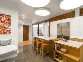 New York City designer Michael Wood used butcher block, soapstone and Corian on this kitchen island with mixed materials. (Allyson Lubow/Michael Wood Interiors)