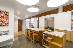 New York City designer Michael Wood used butcher block, soapstone and Corian on this kitchen island with mixed materials. (Allyson Lubow/Michael Wood Interiors)