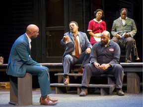 Nigel Shawn Williams, as Troy Maxon, talks to his son Lyons, played by Christopher Bautista with Ordena Stephens-Thompson, as Rose, Peter N. Bailey, as Gabriel, and E. B. Smith, as Bono, lower centre, in the Grand Theatre's production of August Wilson's Fences, on until April 6. (Mike Hensen/The London Free Press)