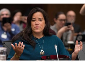 Former Canadian Justice Minister Jody Wilson-Raybould testifies about the SNC-LAVALIN affair before a justice committee hearing on Parliament Hill in Ottawa on Feb. 27. The Montreal-based firm was charged in 2015 with corruption for allegedly bribing officials in Libya between 2001 and 2011 to secure government contracts during former strongman Moammar Gadhafi's reign.