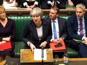 A handout photograph released by the UK Parliament on March 13, 2019 shows Britain's Prime Minister Theresa May responding to the result of a vote in the House of Commons in London on March 13, 2019 in which MPs signalled their opposition to leaving the EU with no deal. - British MPs signalled their opposition Wednesday to leaving the EU with no deal on March 29, in another blow to Prime Minister Theresa May's authority which opens the door to Britain requesting a Brexit delay. (Photo by MARK DUFFY / UK PARLIAMENT / AFP)