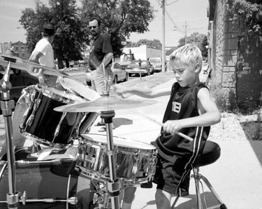 At age eight, a young Justin Bieber demonstrates his drumming skills on the streets of Stratford in this Beacon Herald file photo from July 2002. (File photo/The Beacon Herald/Postmedia Network)