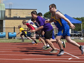 Runners burst from the start of a men's 100-metre race at a Special Olympics regional invitational track and field meet at Kiwanis Field in Brantford. (Postmedia file photo)