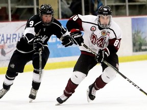 Chatham Maroons' Evan Wells (88) is chased by Komoka Kings' Cameron Welch (9) in the first period at Chatham Memorial Arena in Chatham, Ont., on Thursday, March 7, 2019. Mark Malone/Chatham Daily News/Postmedia Network