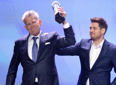 Michael Buble presented David Foster with the Humanitarian Award for his generosity and work with the David Foster Foundation that financially assists families in need of life-saving organ transplants. Photo taken  in London, Ont. on Saturday March 16, 2019. Foster created the charity 33 years ago after being deeply moved by a meeting with a girl in need of a liver transplant from his hometown of Victoria, B.C. Derek Ruttan/The London Free Press/Postmedia Network