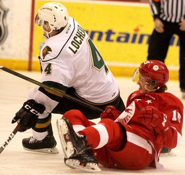 London Knights William Lochead gets tangled up with Soo Greyhouunds Alex Johnston during first-period Ontario Hockey League action at GFL Memorial Gardens in Sault Ste. Marie, Ont., on Friday,March 15, 2019. (BRIAN KELLY/THE SAULT STAR/POSTMEDIA NETWORK)