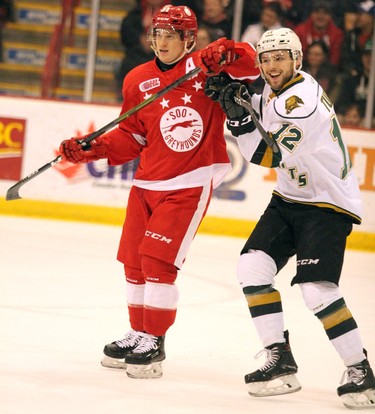 Soo Greyhounds Mac Hollowell tangles with London Knights Alex Turko during first-period Ontario Hockey League action at GFL Memorial Gardens in Sault Ste. Marie, Ont., on Friday,March 15, 2019. (BRIAN KELLY/THE SAULT STAR/POSTMEDIA NETWORK)