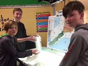Nicholas Wilson public school students Jacob Sillick, left, James Wanzel and Ethan Doan try out the Upper Thames River Conservation Authority’s flood-themed escape room Tuesday March 26. The new initiative is meant to educate students about flooding hazards.