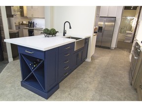 Brizo Blue Island by Abbeyhill Cabinetry features an apron sink and quartz countertop.