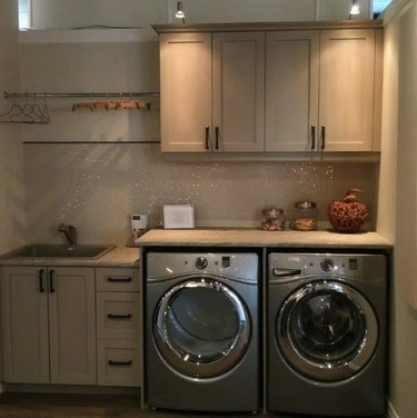 Another view of cabinetry from Cabinetsmith, an easy way to create a functional and stylish laundry room.