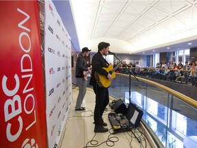 Ivory Hours performs over lunch at a noon-hour concert Thursday on the mezzanine level of One London Place as part of the leadup to the Juno Awards this weekend in London. The band features the vocals of Luke Roes, right, as well as bassist Chris Levesque and drummer Thomas Perquin (not at show). (Mike Hensen/The London Free Press)
