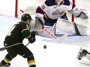 Connor McMichael of the Knights tries control a bouncing puck in front of Saginaw goaltender Ivan Prosvetov during a recent game at Budweiser Gardens. MIKE HENSEN, The London Free Press