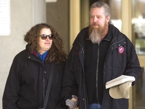 Victoria and Kevin Williams walk out of court Friday after a judge sentenced Nathan Hathaway to four years in jail. Hathaway crashed into their minivan in 2016 while high on meth, causing severe injuries including brain injury to the couple as well as two of their children in the van. (MIKE HENSEN, The London Free Press)