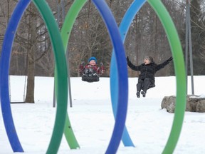 Nine-year-old Aaron Granger swings with his great-aunt Barb Ryland at the playground in Pinafore Park in St. Thomas, Ont. on Sunday March 3, 2019. Derek Ruttan/The London Free Press/Postmedia Network