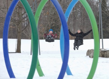 Nine-year-old Aaron Granger swings with his great-aunt Barb Ryland at the playground in Pinafore Park in St. Thomas, Ont. on Sunday March 3, 2019. Derek Ruttan/The London Free Press/Postmedia Network