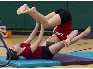 Rachael Wiley (7) (bottom) and Danica Silva (7) of St. Anne's Catholic School in St. Thomas perform a cookie roll during the London District Catholic school board gymnastics meet at the Carling Heights Optimist Centre in London, Ont. on Tuesday March 5, 2019. The five-day meet wrapped up on Tuesday having seen more than 2,500 participants from 45 schools. Derek Ruttan/The London Free Press/Postmedia Network