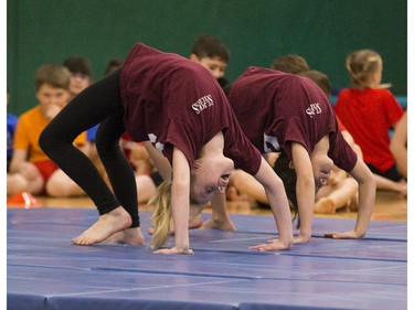 DD Sym (9) (left) and Randi Cordeiro (9) of St. Joseph's Catholic School in Tillsonburg perform during the London District Catholic school board gymnastics meet at the Carling Heights Optimist Centre in London, Ont. on Tuesday March 5, 2019. The five-day meet wrapped up on Tuesday having seen more than 2,500 participants from 45 schools. Derek Ruttan/The London Free Press/Postmedia Network