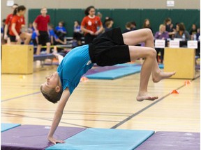 Aidan Bryce (9) of St. Paul Catholic School in London performs a front walkover during the London District Catholic school board gymnastics meet at the Carling Heights Optimist Centre in London, Ont. on Tuesday March 5, 2019. The five-day meet wrapped up on Tuesday having seen more than 2,500 participants from 45 schools. Derek Ruttan/The London Free Press/Postmedia Network